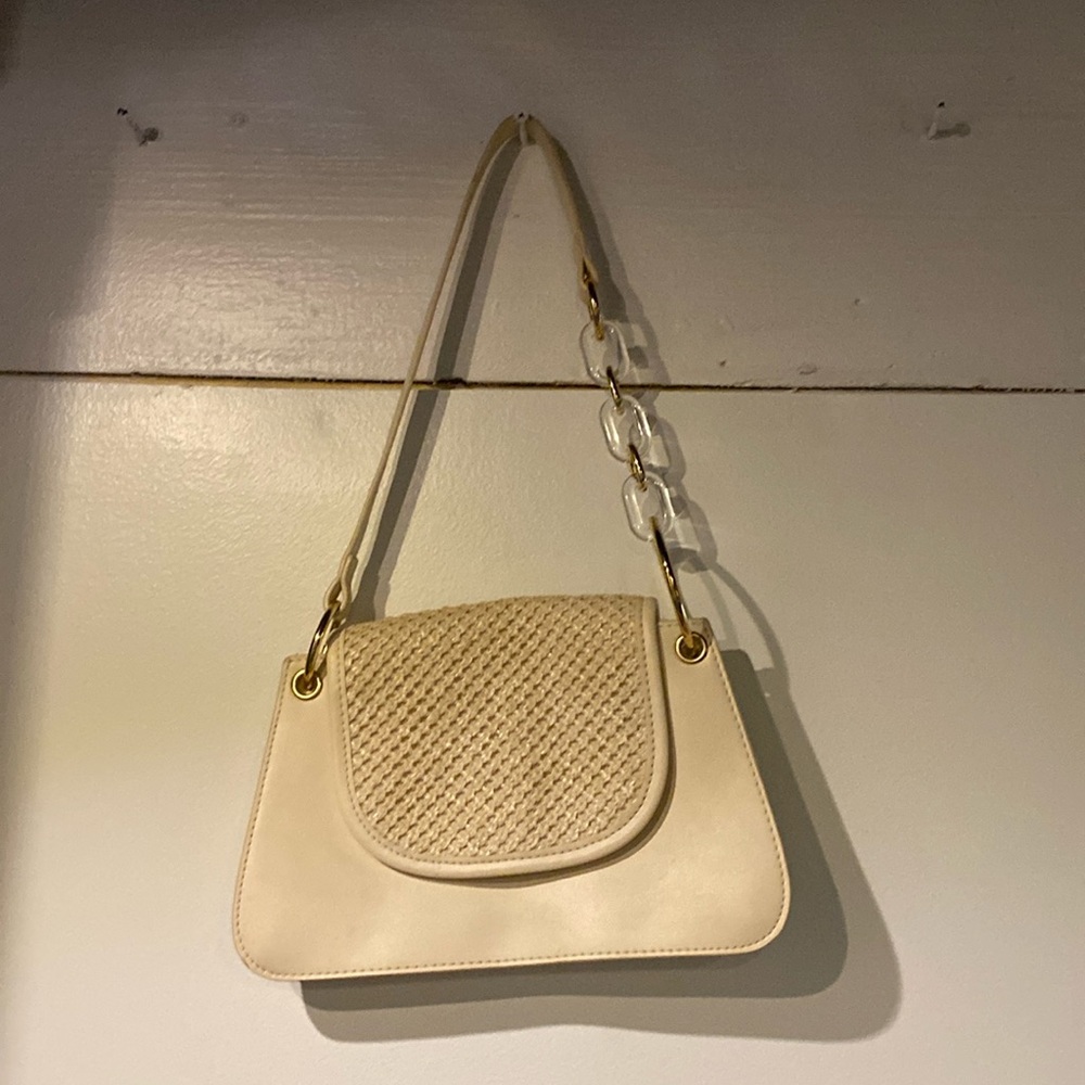 White purse with gold and clear handle decor